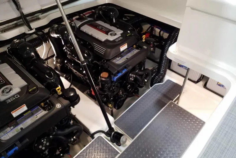 Slide: The Image of 2019 Formula 330 Crossover Bowrider storage compartment with cleaning brush. - 14