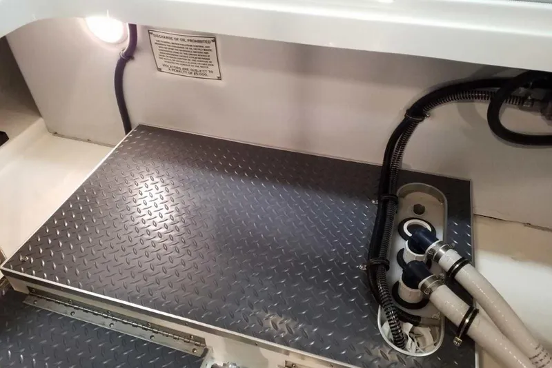 Slide: The Image of 2019 Formula 330 Crossover Bowrider interior with sleek seating and stainless steel accents. - 15