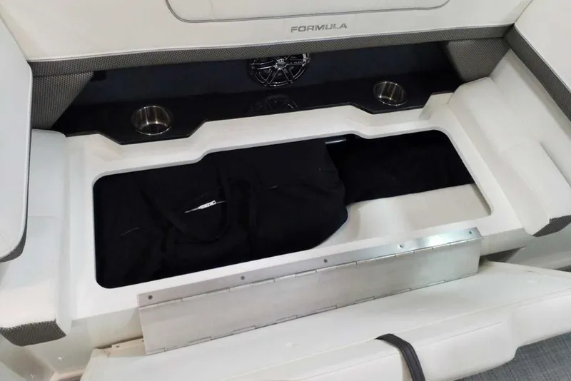 Slide: The Image of 2019 Formula 330 Crossover Bowrider storage compartment with integrated cooler. - 22