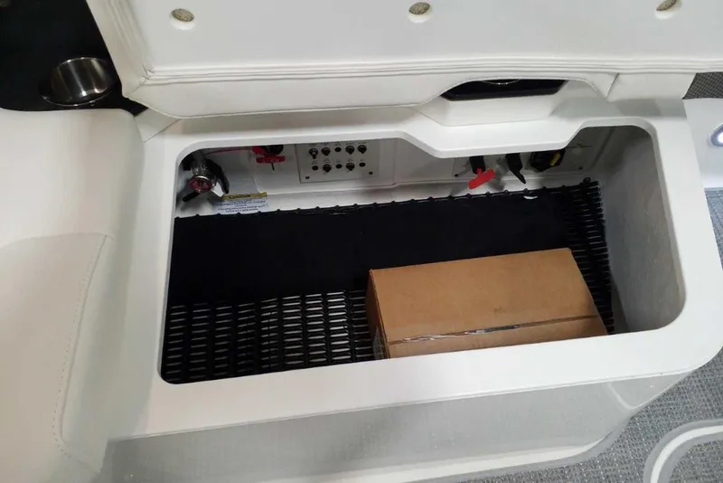 Slide: The Image of Open storage compartment on 2019 Formula 330 Crossover Bowrider boat. - 24