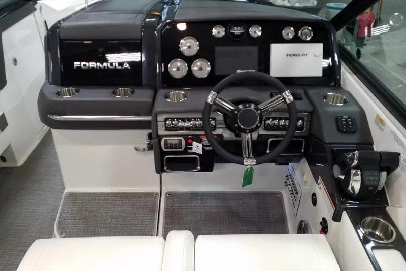 Slide: The Image of 2019 Formula 330 Crossover Bowrider interior with white seating and modern design. - 25