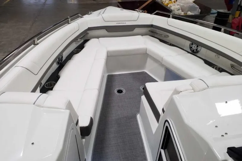 Slide: The Image of Luxurious seating in 2019 Formula 330 Crossover Bowrider boat interior with ambient lighting. - 27
