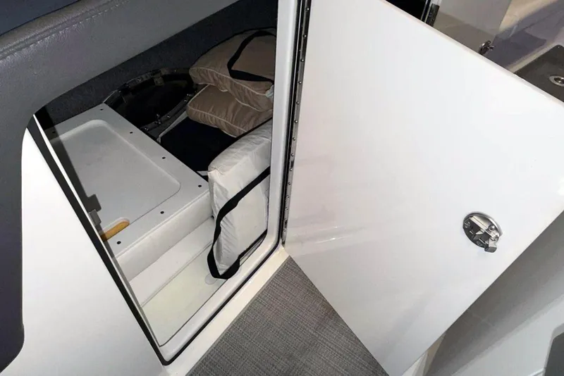 Slide: The Image of 2019 Formula 330 Crossover Bowrider storage compartment with cushions and equipment. - 39
