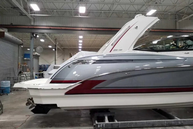 Slide: The Image of 2019 Formula 330 Crossover Bowrider boat detail with stainless steel anchor in a storage facility. - 4