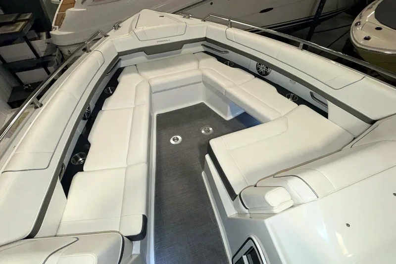 Slide: The Image of 2019 Formula 330 Crossover Bowrider interior with spacious white seating and modern design. - 42
