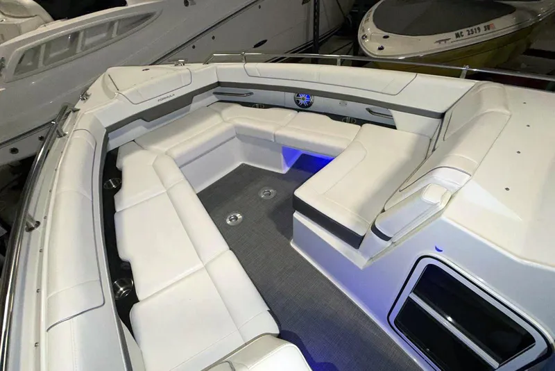 Slide: The Image of 2019 Formula 330 Crossover Bowrider with spacious white seating and modern design. - 43