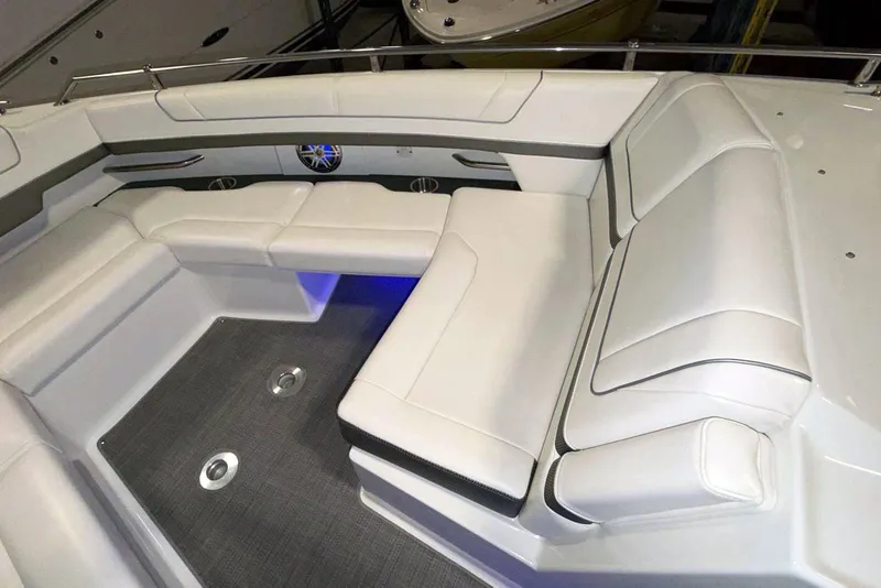 Slide: The Image of 2019 Formula 330 Crossover Bowrider interior with white seating and modern design. - 44