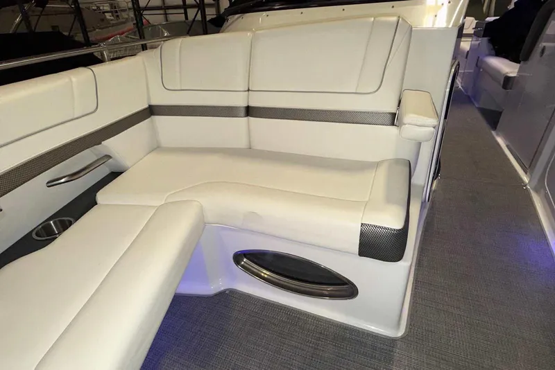 Slide: The Image of 2019 Formula 330 Crossover Bowrider interior with white cushioned seating and modern design. - 45