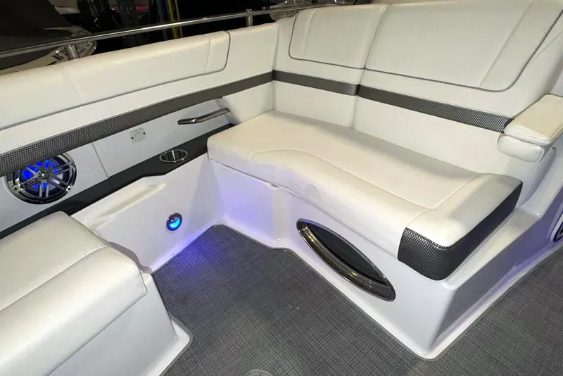 Slide: The Image of 2019 Formula 330 Crossover Bowrider interior with white seating and blue LED lighting. - 46