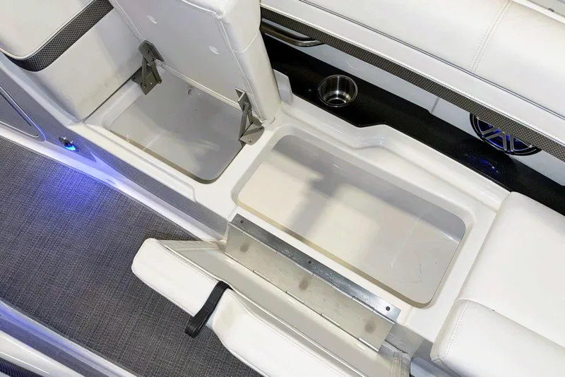 Slide: The Image of 2019 Formula 330 Crossover Bowrider interior with storage compartments and cup holders. - 48