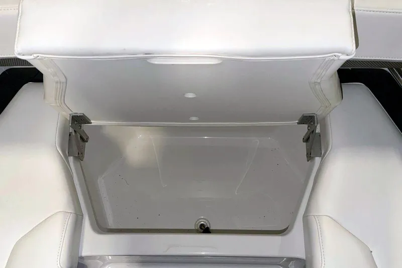 Slide: The Image of Open storage compartment in 2019 Formula 330 Crossover Bowrider boat with white interior. - 50