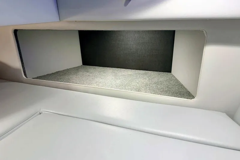 Slide: The Image of Interior storage compartment of 2019 Formula 330 Crossover Bowrider boat. - 57