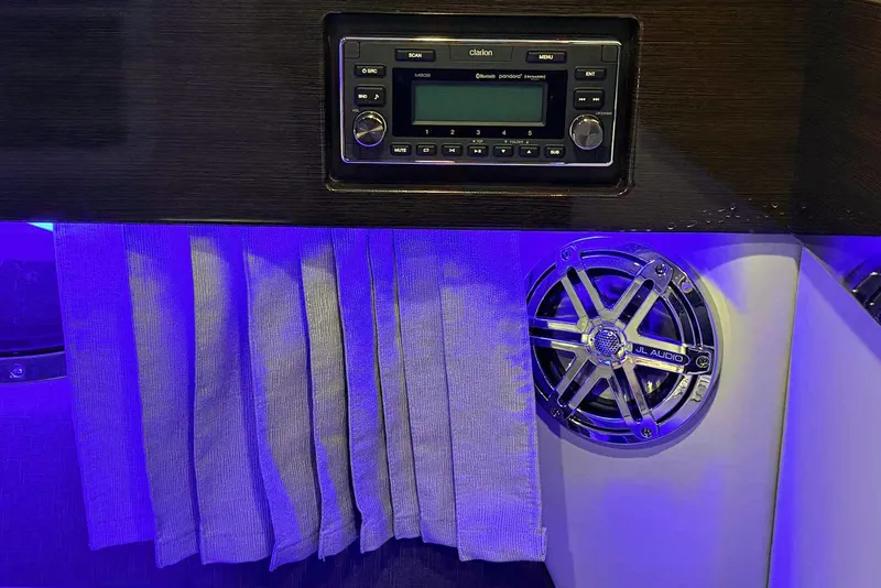 Slide: The Image of 2019 Formula 330 Crossover Bowrider interior with audio system and blue ambient lighting. - 58