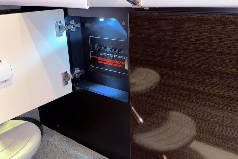 Slide: The Image of 2019 Formula 330 Crossover Bowrider electrical panel inside open cabinet. - 60