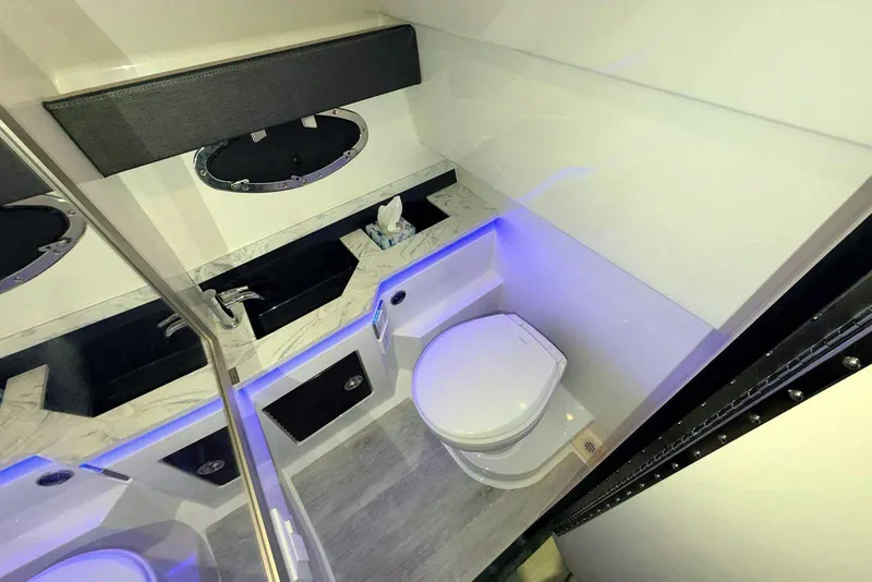 Slide: The Image of Luxurious bathroom in 2019 Formula 330 Crossover Bowrider with modern fixtures and ambient lighting. - 63