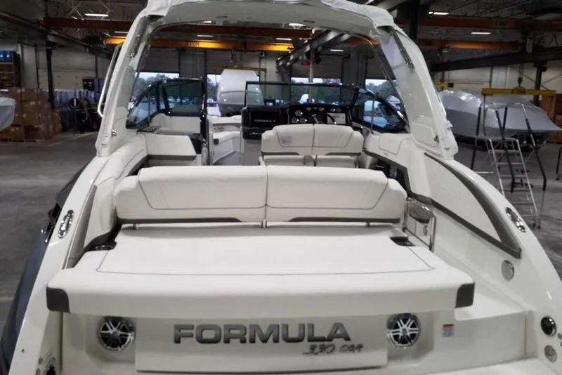 Slide: The Image of Twin MerCruiser engines on a 2019 Formula 330 Crossover Bowrider boat. - 8
