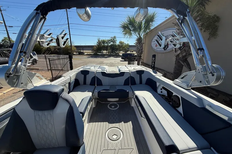 Slide: The Image of 2023 MasterCraft XT23 boat interior with sleek seating and modern design. - 14