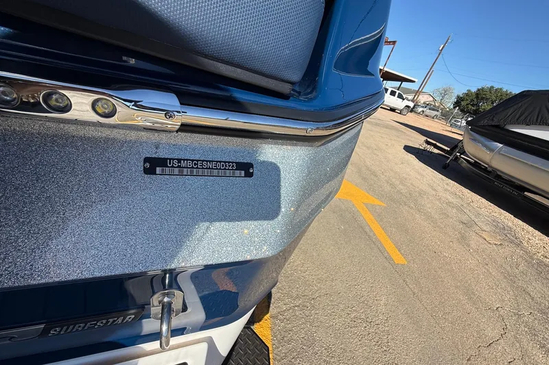 Slide: The Image of 2023 MasterCraft XT23 boat with identification plate and metallic finish. - 17