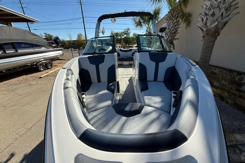 Slide: The Image of 2023 MasterCraft XT23 boat interior with sleek seating and modern design. - 3