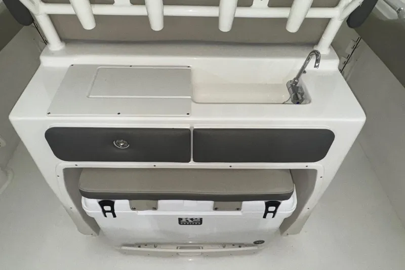 Slide: The Image of 2025 Key West 263 FS boat interior with sink, storage, and cooler. - 22