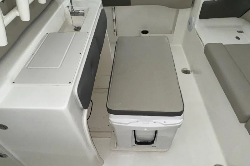 Slide: The Image of 2025 Key West 263 FS boat interior with seating and storage area. - 23