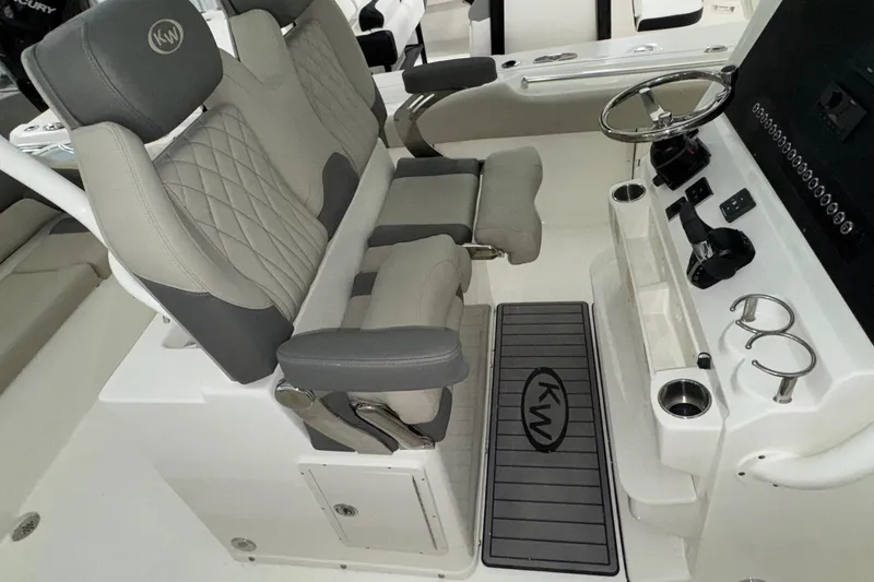 Slide: The Image of 2025 Key West 263 FS boat interior with dual seats and steering console. - 13