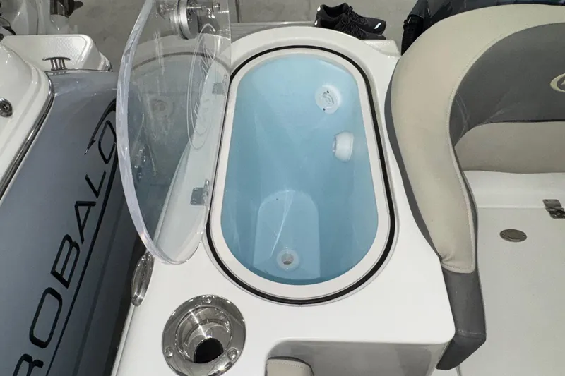 Slide: The Image of Livewell on 2025 Key West 263 FS boat, featuring a clear lid and cup holder. - 21