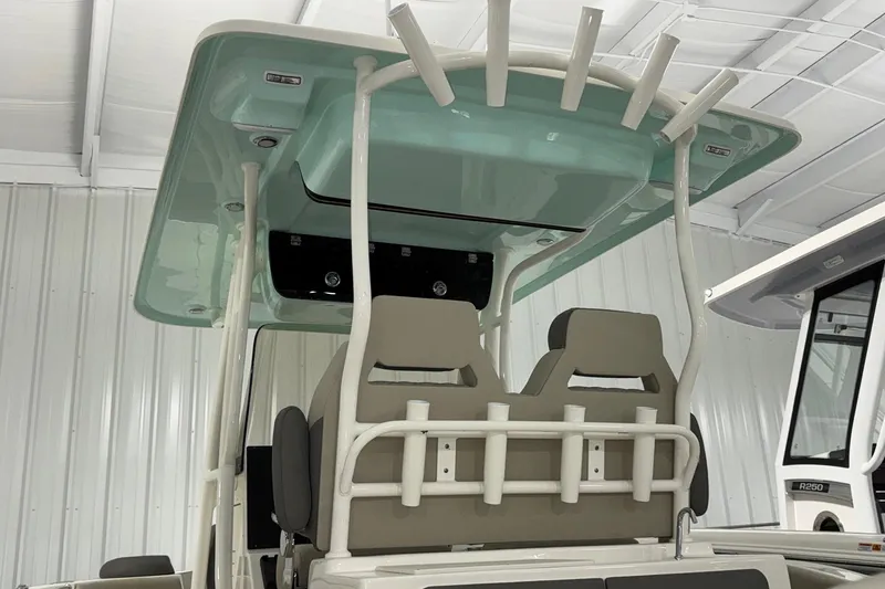 Slide: The Image of 2025 Key West 263 FS boat interior with teal canopy and dual seats. - 5