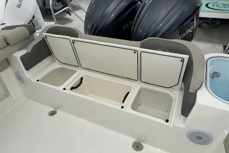 Slide: The Image of 2025 Key West 263 FS boat interior with storage compartments and Yamaha engines. - 20