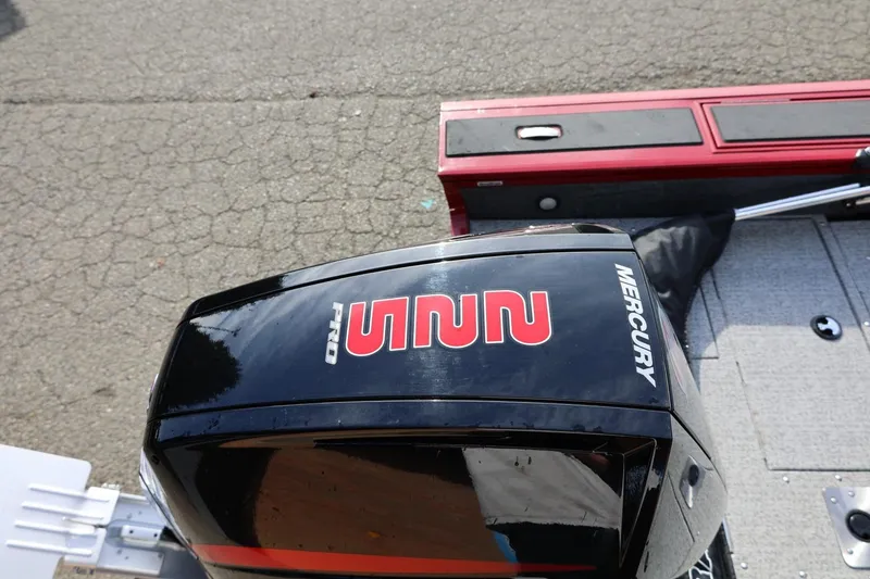 Slide: The Image of 2022 Tracker Targa V-19 WT boat with Mercury outboard motor on pavement. - 11