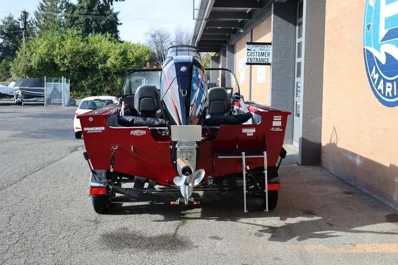 Slide: The Image of 2022 Tracker Targa V-19 WT boat parked outside a marine store. - 15