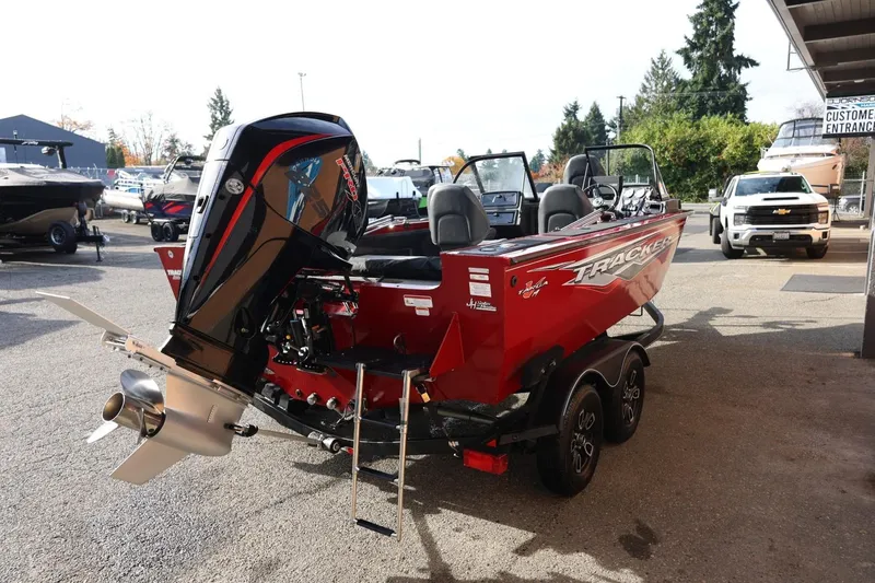 Slide: The Image of 2022 Tracker Targa V-19 WT boat with powerful outboard motor, parked outdoors. - 16