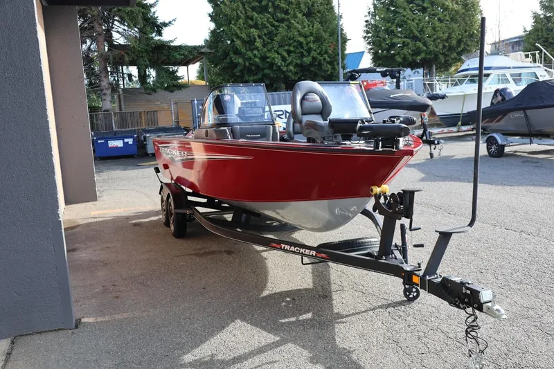 Slide: The Image of 2022 Tracker Targa V-19 WT boat on trailer, parked outdoors. - 17
