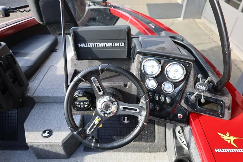 Slide: The Image of 2022 Tracker Targa V-19 WT boat dashboard with steering wheel and Humminbird electronics. - 4
