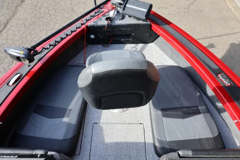 Slide: The Image of 2022 Tracker Targa V-19 WT boat interior with seating and control panel. - 7