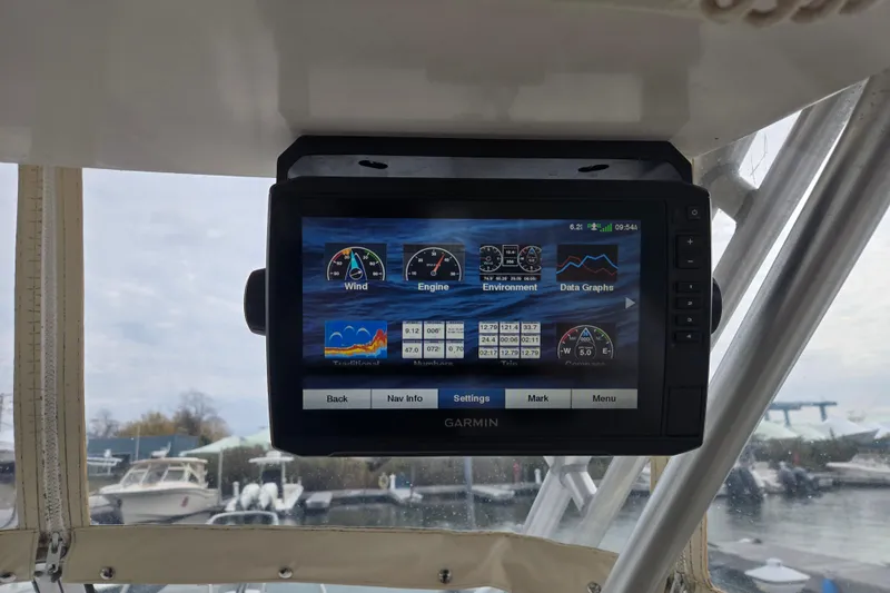 Slide: The Image of Garmin navigation display on 2003 Grady-White Voyager 258 boat, showing wind and engine data. - 5