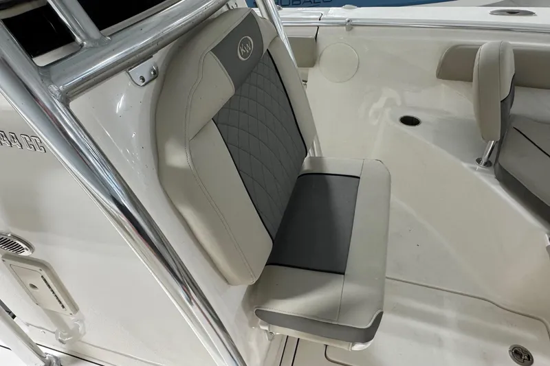 Slide: The Image of 2026 Key West 244 Center Console boat interior with cushioned seating and sleek design. - 9
