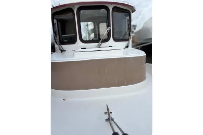 Slide: The Image of 2009 Ranger Tugs R21-EC boat, close-up of cabin and deck details. - 12
