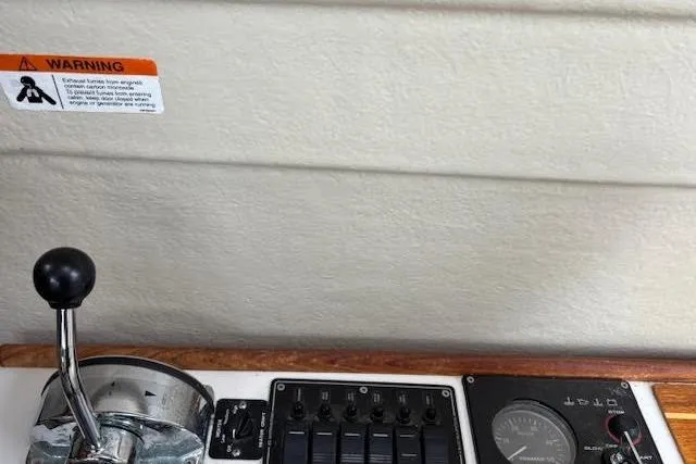 Slide: The Image of Control panel of 2009 Ranger Tugs R21-EC boat with throttle and gauges. - 25