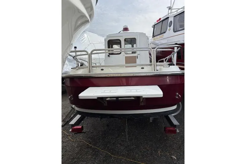 Slide: The Image of 2009 Ranger Tugs R21-EC boat, rear view, parked on a trailer. - 3