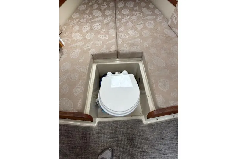 Slide: The Image of 2009 Ranger Tugs R21-EC interior with a compact marine toilet. - 30