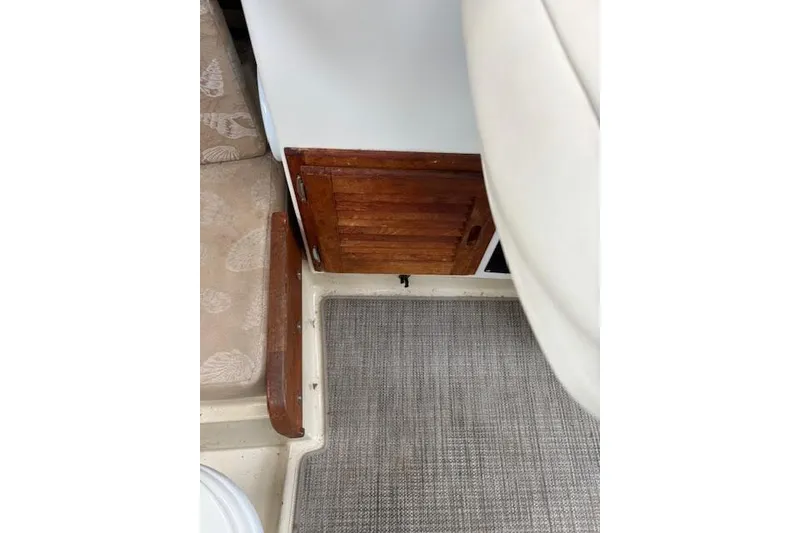 Slide: The Image of Interior of 2009 Ranger Tugs R21-EC with wooden cabinet and cushioned seating. - 32