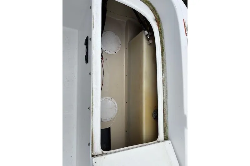 Slide: The Image of 2009 Ranger Tugs R21-EC interior view, showcasing cabin details and structure. - 36