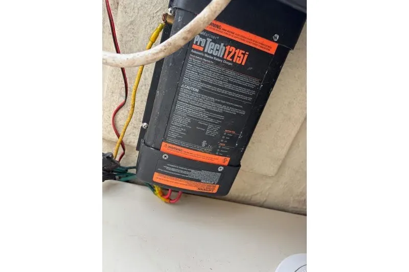 Slide: The Image of Battery charger in a 2009 Ranger Tugs R21-EC boat, featuring ProTech 1215i model. - 37