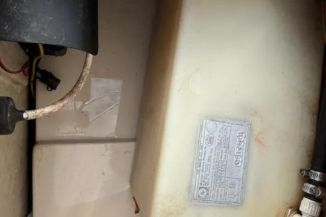 Slide: The Image of Engine compartment of 2009 Ranger Tugs R21-EC with visible components and label. - 38