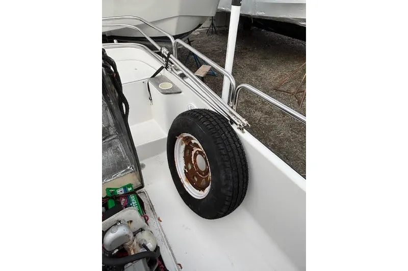 Slide: The Image of 2009 Ranger Tugs R21-EC boat deck with spare tire and railing. - 8