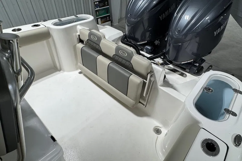 Slide: The Image of 2026 Key West 244 Center Console boat interior with dual Yamaha engines and seating. - 13