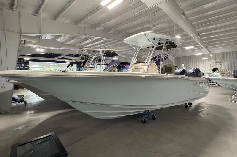 Slide: The Image of 2026 Key West 244 Center Console boat displayed in a showroom. - 3
