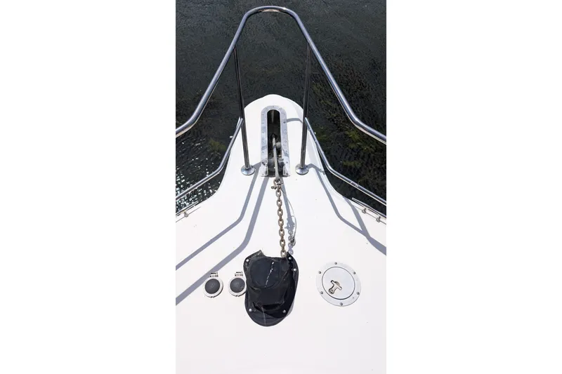 Slide: The Image of Bow of 1994 Sea Ray 500 Sundancer with anchor chain and railing. - 10