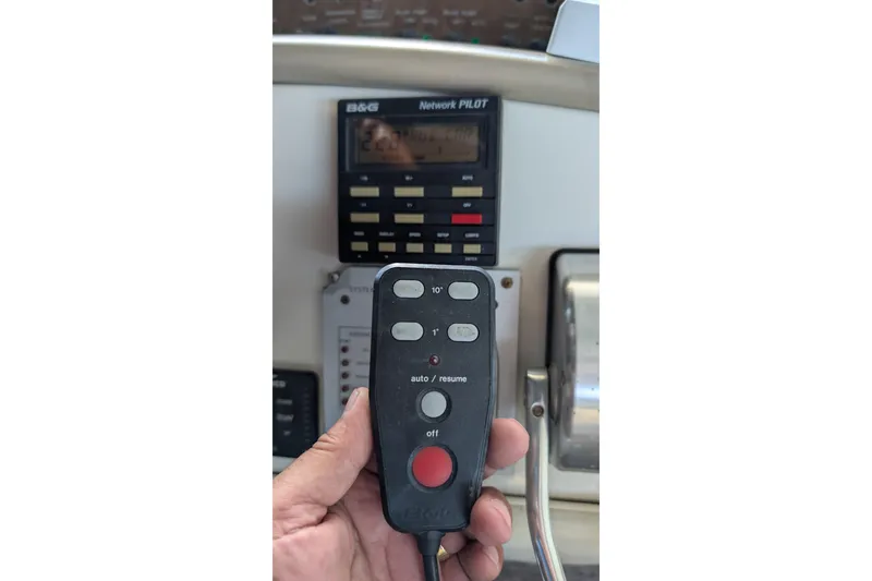 Slide: The Image of Hand holding remote control in Sea Ray 500 Sundancer yacht cockpit, 1994 model. - 15